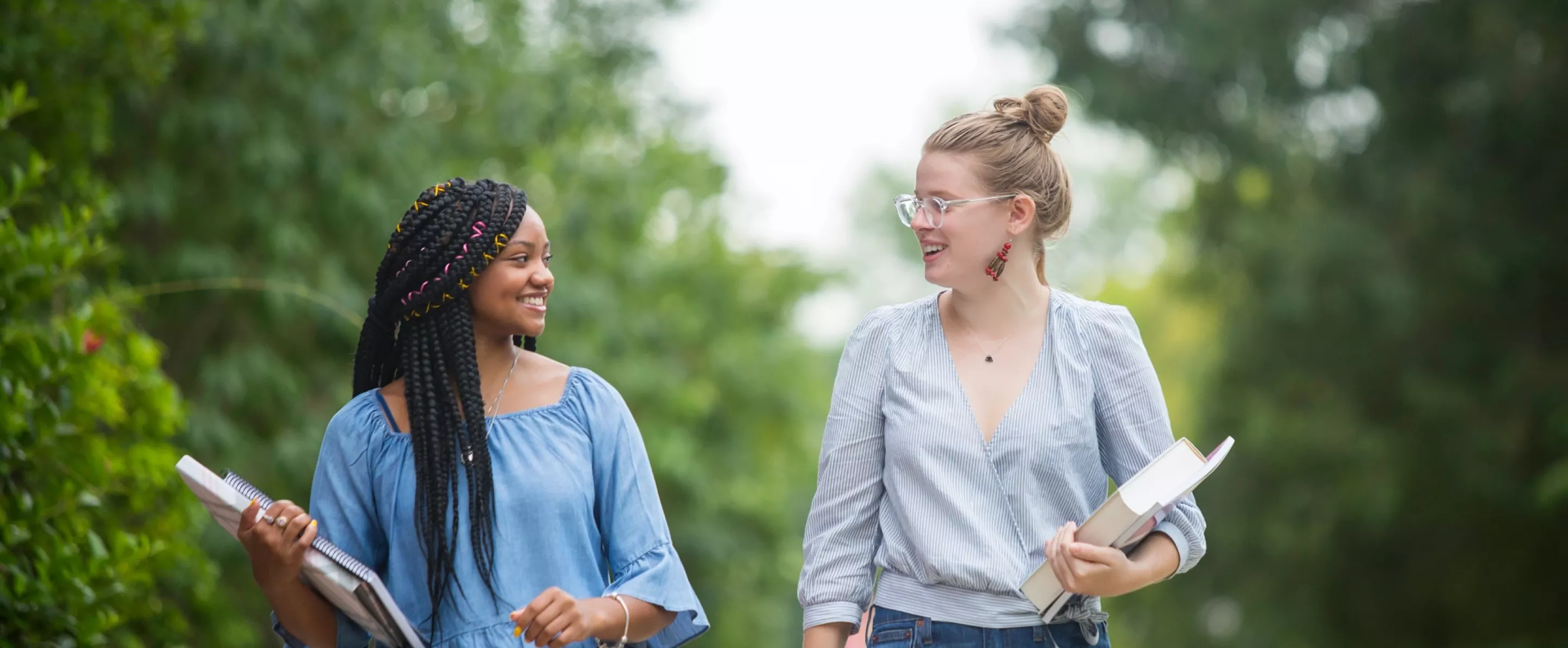 Two students walking on the Belknap campus