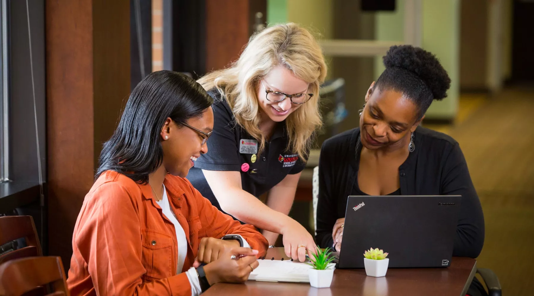 SPHIS advisors talking to a student