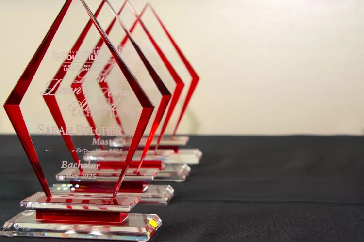 Row of Public Health Awards on a black table cloth