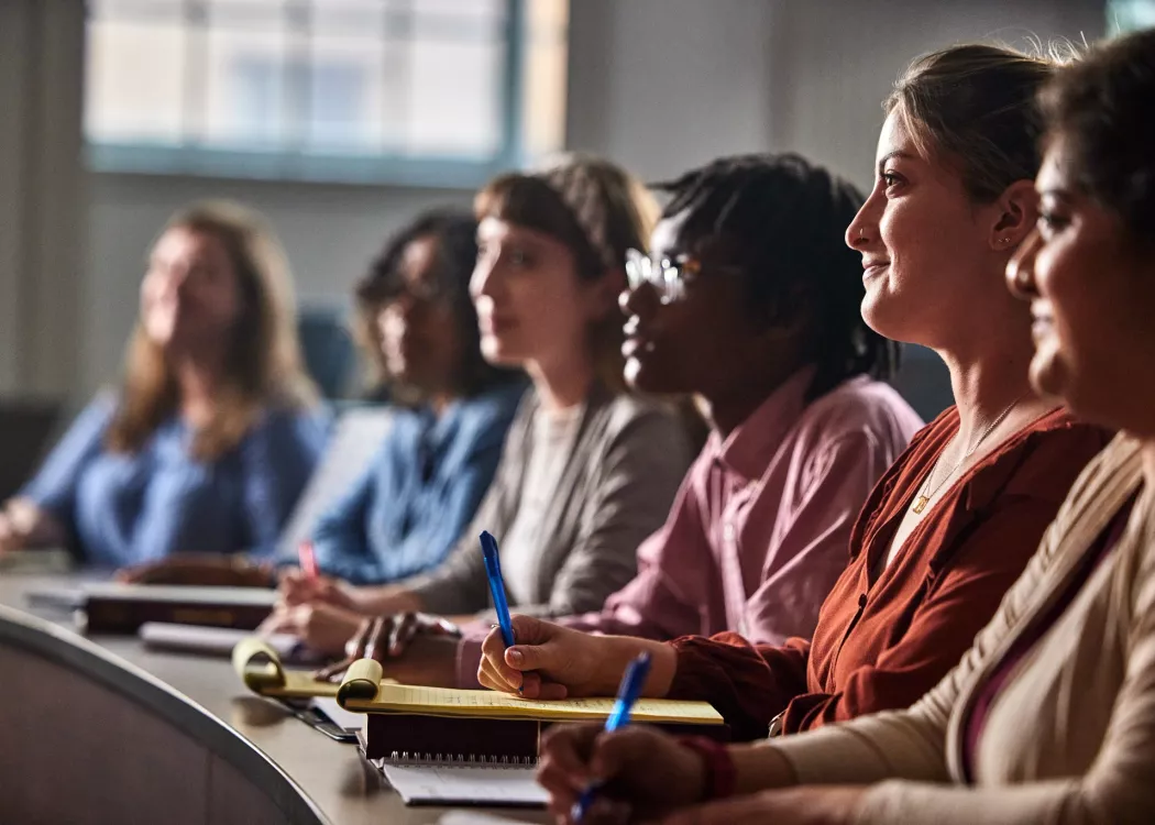 Multiple law students listen to a lecture
