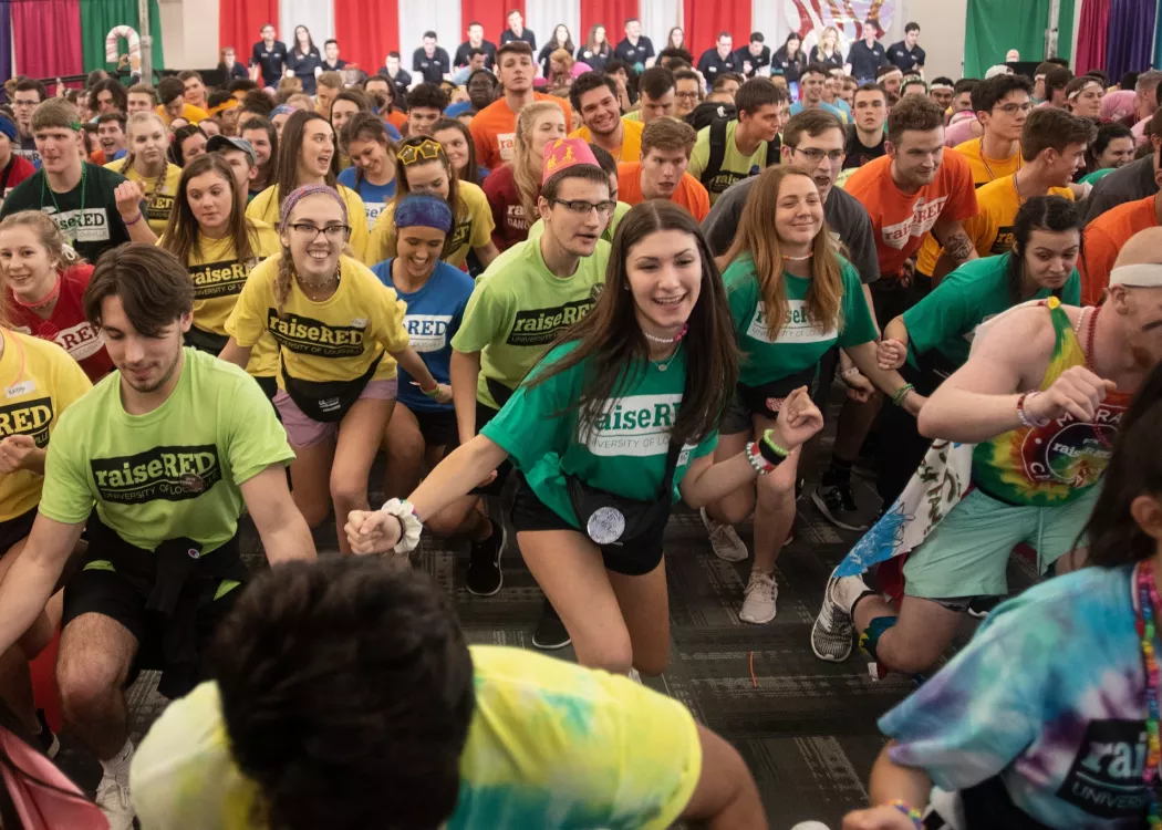 A crowd of students dance through the night to raise money for Kosair at the raiseRED Dance Marathon