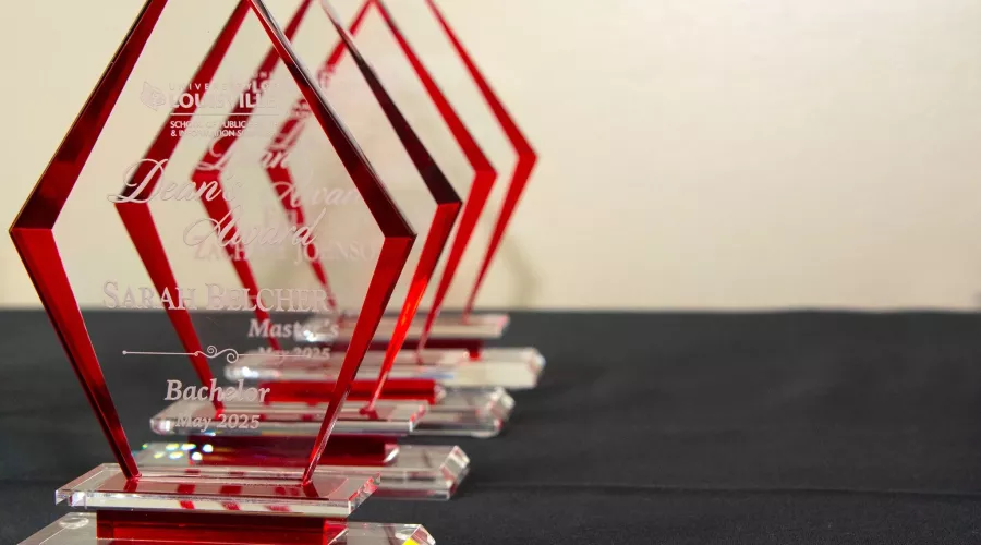 Row of Public Health Awards on a black table cloth